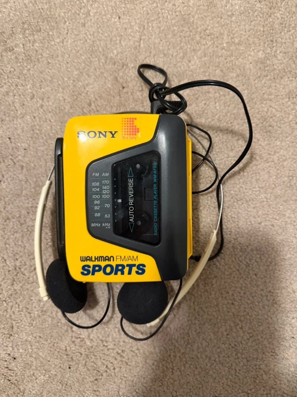 Vintage Sony Yellow and Black Walkman FM/AM Sports Cassette Player